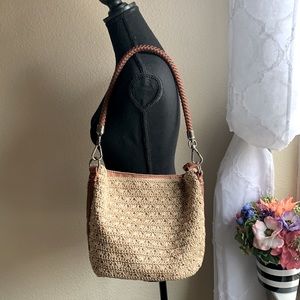 The Sak purse tan with golden shine medium size.